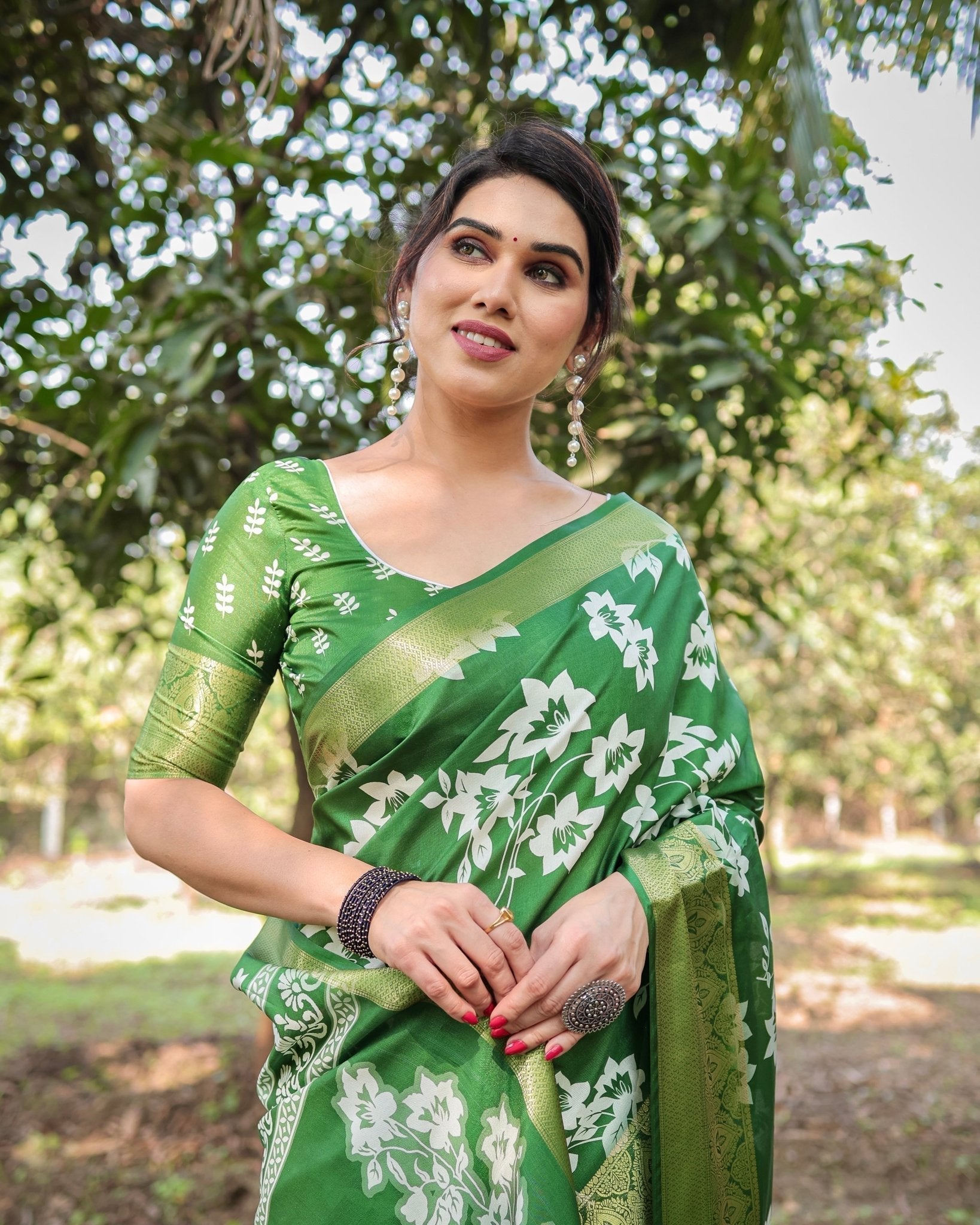 Enchanting Green Tussar Silk Saree with White Floral Prints and Zari Border