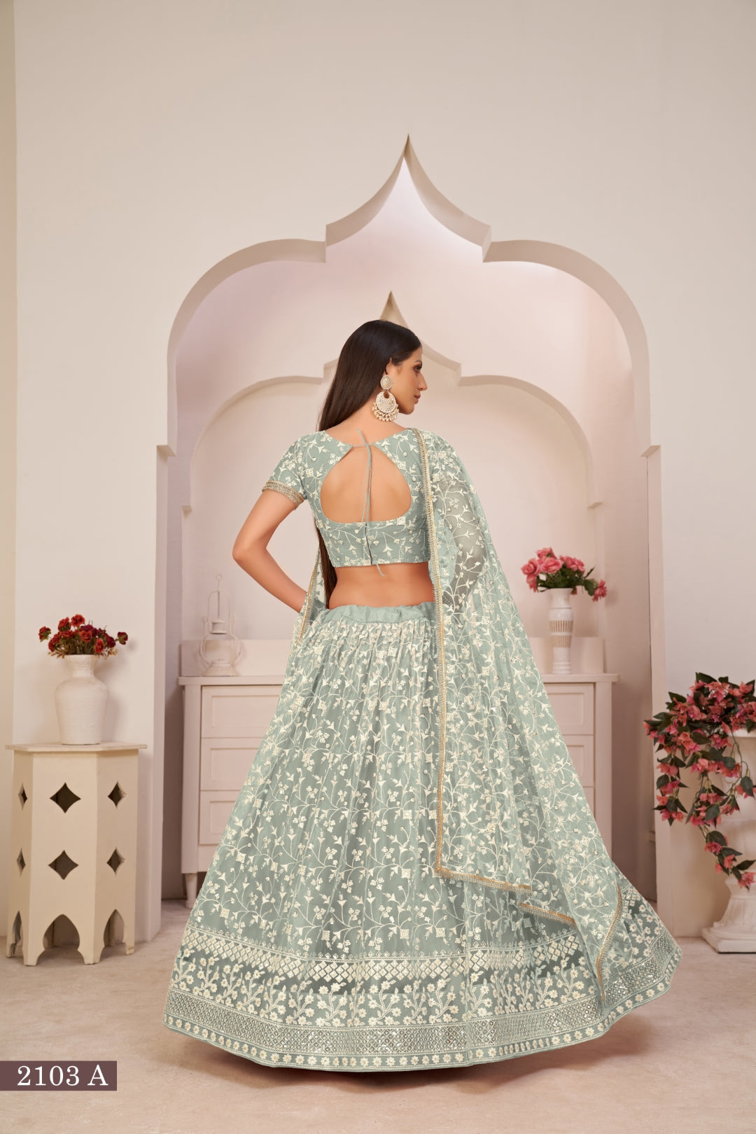 Turquolse Green Elegant Butterfly Net Lehenga with Intricate Embroidery