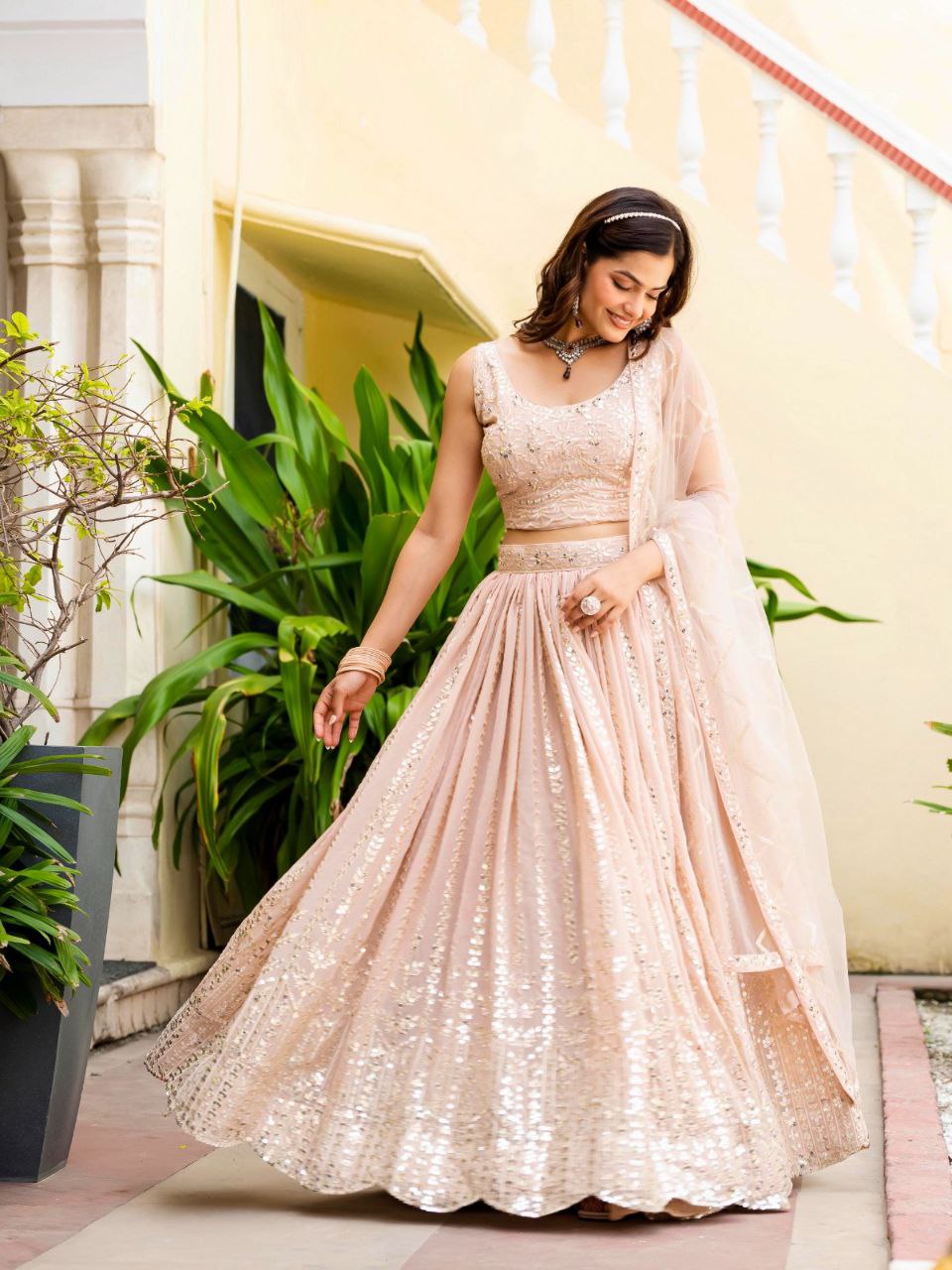 Warm Peach Luxurious Faux Georgette Zari & Sequin Embroidered Semi-Stitched Lehenga Choli with Net Embroidered Dupatta