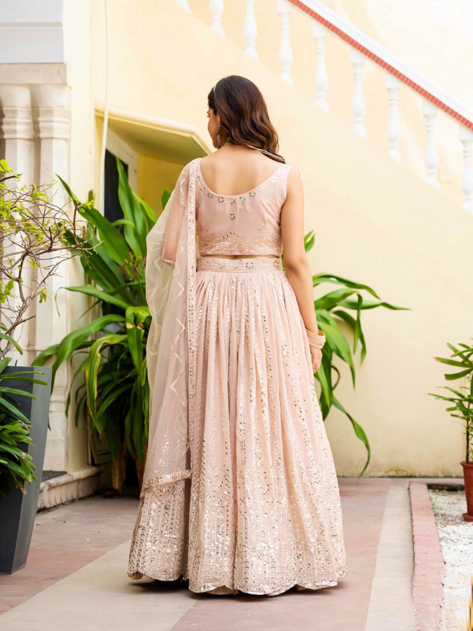 Warm Peach Luxurious Faux Georgette Zari & Sequin Embroidered Semi-Stitched Lehenga Choli with Net Embroidered Dupatta