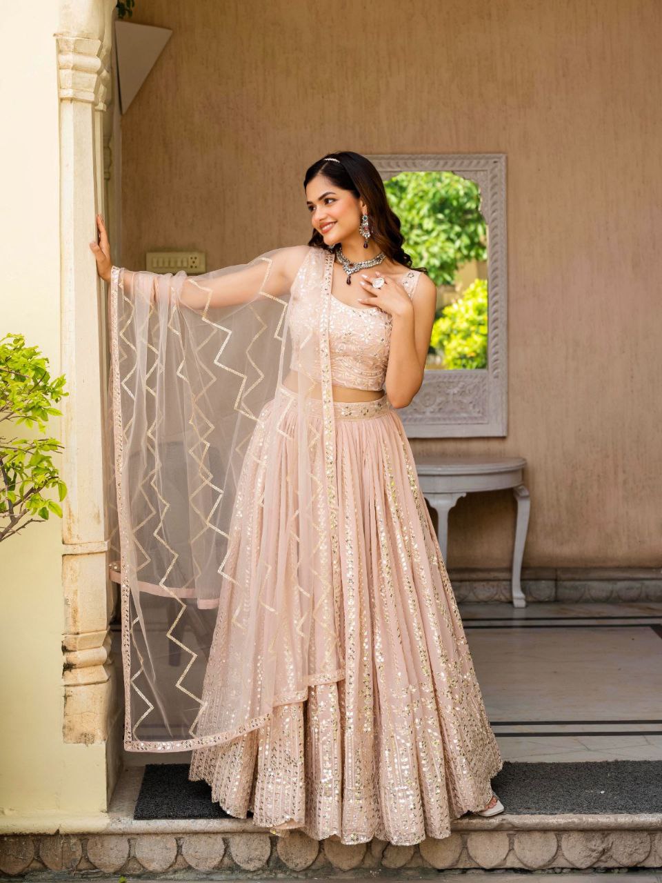 Warm Peach Luxurious Faux Georgette Zari & Sequin Embroidered Semi-Stitched Lehenga Choli with Net Embroidered Dupatta