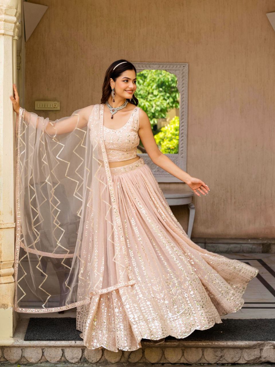Warm Peach Luxurious Faux Georgette Zari & Sequin Embroidered Semi-Stitched Lehenga Choli with Net Embroidered Dupatta