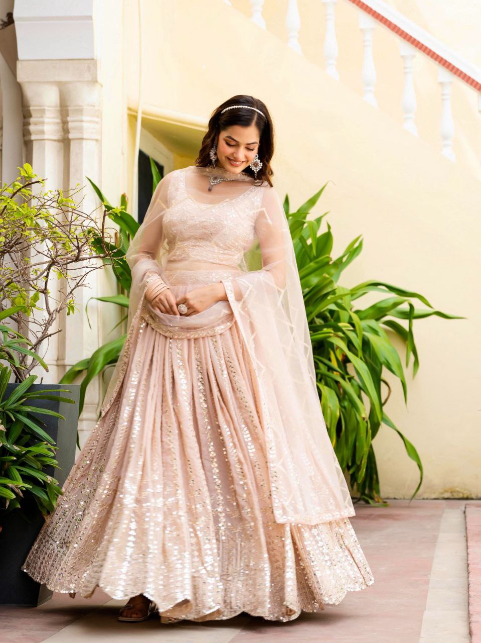 Warm Peach Luxurious Faux Georgette Zari & Sequin Embroidered Semi-Stitched Lehenga Choli with Net Embroidered Dupatta