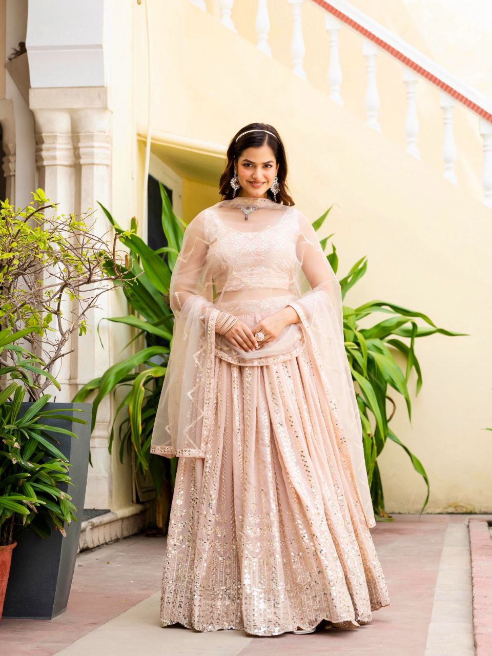 Warm Peach Luxurious Faux Georgette Zari & Sequin Embroidered Semi-Stitched Lehenga Choli with Net Embroidered Dupatta