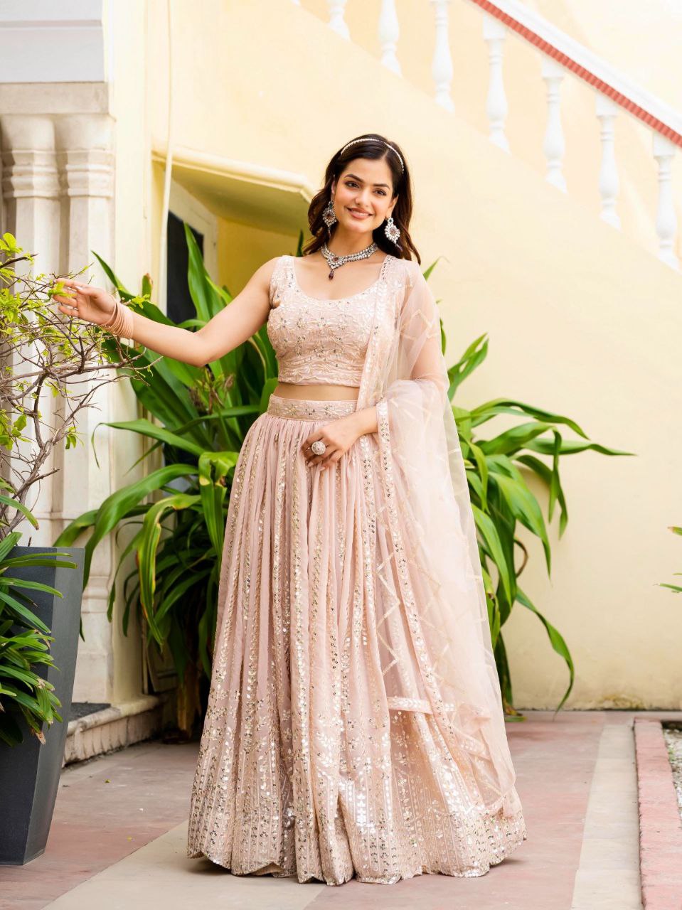 Warm Peach Luxurious Faux Georgette Zari & Sequin Embroidered Semi-Stitched Lehenga Choli with Net Embroidered Dupatta