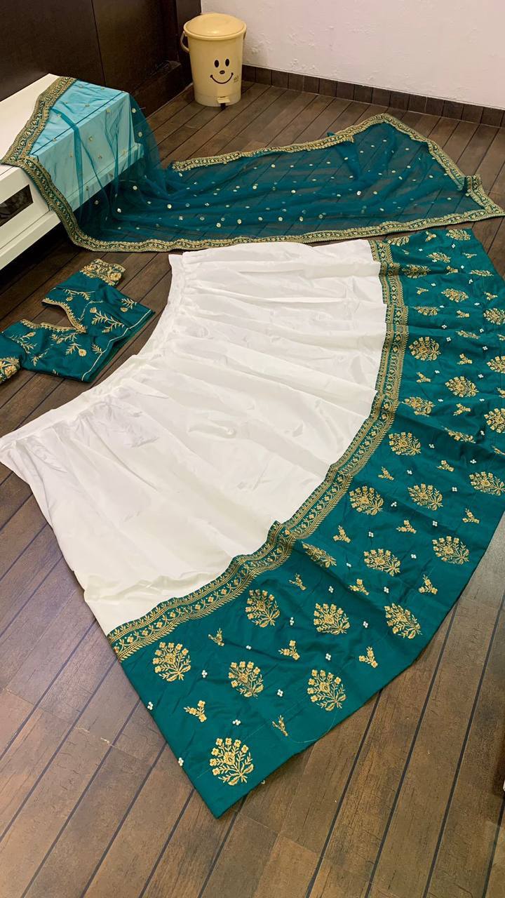 White Elegant Tapeta Silk Lehenga with Pearl & Embroidery Work