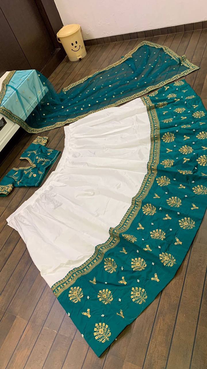 White Elegant Tapeta Silk Lehenga with Pearl & Embroidery Work